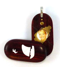 Load image into Gallery viewer, 0026 Thin Sail Boat Illusionist Locket That Transforms Into a Dolphin Locket Rosewood Burgundy
